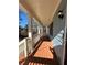 Spacious front porch with wooden flooring, white railing, and surrounding trees at 941 Capitol View Ave, Atlanta, GA 30318
