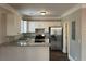 Modern kitchen with white cabinets, granite countertops, and stainless steel appliances at 941 Capitol View Ave, Atlanta, GA 30318