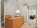 Basement bar area with wood cabinetry and tile flooring at 6320 Murets Rd, Alpharetta, GA 30022