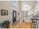 Bright two-story foyer with hardwood floors and staircase at 6320 Murets Rd, Alpharetta, GA 30022