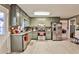 Spacious kitchen featuring stainless steel appliances, granite countertops, and ample cabinetry at 25 Salem Branch Ct, Covington, GA 30016