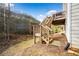 Elevated wooden deck and stairs in a spacious backyard at 264 Creek View Pl, Canton, GA 30114