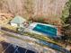 Community pool with a covered area and surrounding trees, viewed aerially at 264 Creek View Pl, Canton, GA 30114