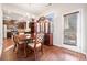 Dining area adjacent to the kitchen, with hardwood floors, a dining table, and a china cabinet at 264 Creek View Pl, Canton, GA 30114