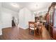 Dining area opens to the kitchen and features hardwood floors, a dining table, and nearby staircase at 264 Creek View Pl, Canton, GA 30114
