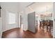 Entryway with wood-look flooring, white door, and view into the dining area at 264 Creek View Pl, Canton, GA 30114