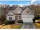 Charming two-story home with a welcoming front porch and attached garage at 264 Creek View Pl, Canton, GA 30114