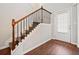 Elegant staircase with wooden handrails and black metal balusters at 264 Creek View Pl, Canton, GA 30114