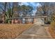 Brick ranch house with a large yard and driveway at 4128 Lindsey Dr, Decatur, GA 30035