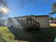 Backyard with a deck, grassy area, and trees at 4262 Catalpa Park, Ellenwood, GA 30294