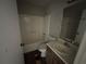 Bathroom with shower/tub combo, vanity sink, and wood-look floor at 4262 Catalpa Park, Ellenwood, GA 30294