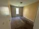 Bedroom with carpet, neutral walls, and a window providing natural light at 4262 Catalpa Park, Ellenwood, GA 30294