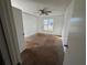 Spacious bedroom with carpet flooring, ceiling fan, and natural light at 4262 Catalpa Park, Ellenwood, GA 30294