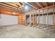 Unfinished basement area with exposed beams and potential for customization at 3104 E Anderson Dr, Lithia Springs, GA 30122