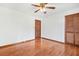 Hardwood floor bedroom with mirrored closet doors at 3104 E Anderson Dr, Lithia Springs, GA 30122