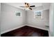 Finished basement room with dark wood floors and ceiling fan at 4130 Seminole Cir, Austell, GA 30106