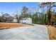 Long concrete driveway leading to a two-story white home at 4130 Seminole Cir, Austell, GA 30106