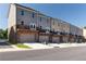 Rear view of townhouses featuring balconies and garages at 3800 Jack Vernon Cir, Powder Springs, GA 30127