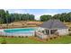 Community pool with a covered pavilion and surrounding fenced yard at 1110 Cades Walk, Lawrenceville, GA 30045