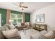 Bright living room with cozy seating and accent wall at 1110 Cades Walk, Lawrenceville, GA 30045