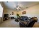 Relaxing living room with leather furniture and ceiling fan at 2236 Mission Ridge Se Dr, Conyers, GA 30013