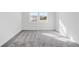 Bright, spacious bedroom with carpet flooring and large windows at 1495 Auburn Glen Rd, Dacula, GA 30019