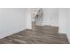 Open dining area with wood-look floors and a view towards the kitchen at 1495 Auburn Glen Rd, Dacula, GA 30019