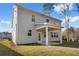 Two-story home with covered back patio and grassy backyard at 1495 Auburn Glen Rd, Dacula, GA 30019