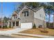 Attractive two-story residence with a mixed siding exterior and a covered entryway at 1495 Auburn Glen Rd, Dacula, GA 30019