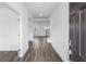 Bright foyer with wood-look flooring and a view of the staircase at 1495 Auburn Glen Rd, Dacula, GA 30019