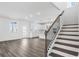 Bright, open living area with view of kitchen and staircase at 1495 Auburn Glen Rd, Dacula, GA 30019