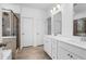 Large ensuite bathroom with double vanity, shower, and soaking tub at 1495 Auburn Glen Rd, Dacula, GA 30019