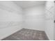 Spacious walk-in closet with built-in shelving at 1495 Auburn Glen Rd, Dacula, GA 30019