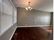 Dining area with contemporary light fixture and large window with blinds at 1947 Kenwood Pl, Smyrna, GA 30082