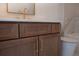 Modern bathroom vanity with brown cabinets and gold hardware at 3790 Ivy Ne Rd, Atlanta, GA 30342