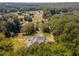 An aerial shot revealing a home's serene location amongst lush greenery and neighboring properties at 772 Old Lathemtown And 776 Rd, Canton, GA 30115