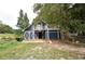 Blue barn with upper level deck and attached stalls at 772 Old Lathemtown And 776 Rd, Canton, GA 30115