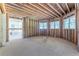 Unfinished basement with windows and sliding doors at 772 Old Lathemtown And 776 Rd, Canton, GA 30115