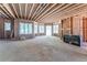 Unfinished basement with a fireplace and large windows at 772 Old Lathemtown And 776 Rd, Canton, GA 30115