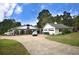 White farmhouse with attached garage, offering ample parking space and curb appeal at 772 Old Lathemtown And 776 Rd, Canton, GA 30115