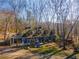 Blue home with wrap-around porch, playground, and wooded setting at 772 Old Lathemtown And 776 Rd, Canton, GA 30115
