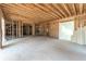 Unfinished basement space with framing and concrete floor at 772 Old Lathemtown And 776 Rd, Canton, GA 30115