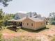 Side and rear view of a new construction two-story house with a deck and porch at 772 Old Lathemtown And 776 Rd, Canton, GA 30115