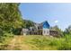 Two-story home with multiple gables and a wrap-around porch under construction at 772 Old Lathemtown And 776 Rd, Canton, GA 30115