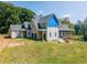 Side view of a two-story home under construction with a wrap-around porch at 772 Old Lathemtown And 776 Rd, Canton, GA 30115