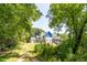 Long driveway leads to a new construction home nestled among trees at 772 Old Lathemtown And 776 Rd, Canton, GA 30115