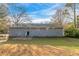 Back view of a gray one-story house with a small backyard at 1347 Peggy Nw Ln, Conyers, GA 30012