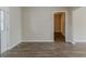 Open dining area with wood-look flooring and access to other living spaces at 1347 Peggy Nw Ln, Conyers, GA 30012