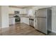 Modern kitchen with white cabinets, stainless steel appliances, and granite countertops at 1347 Peggy Nw Ln, Conyers, GA 30012