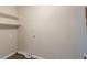 Laundry room with built-in shelves and dryer vent at 1347 Peggy Nw Ln, Conyers, GA 30012